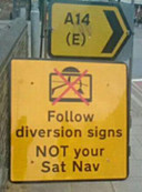 [Road sign in Cambridge: Follow diversion signs not your sat nav] 